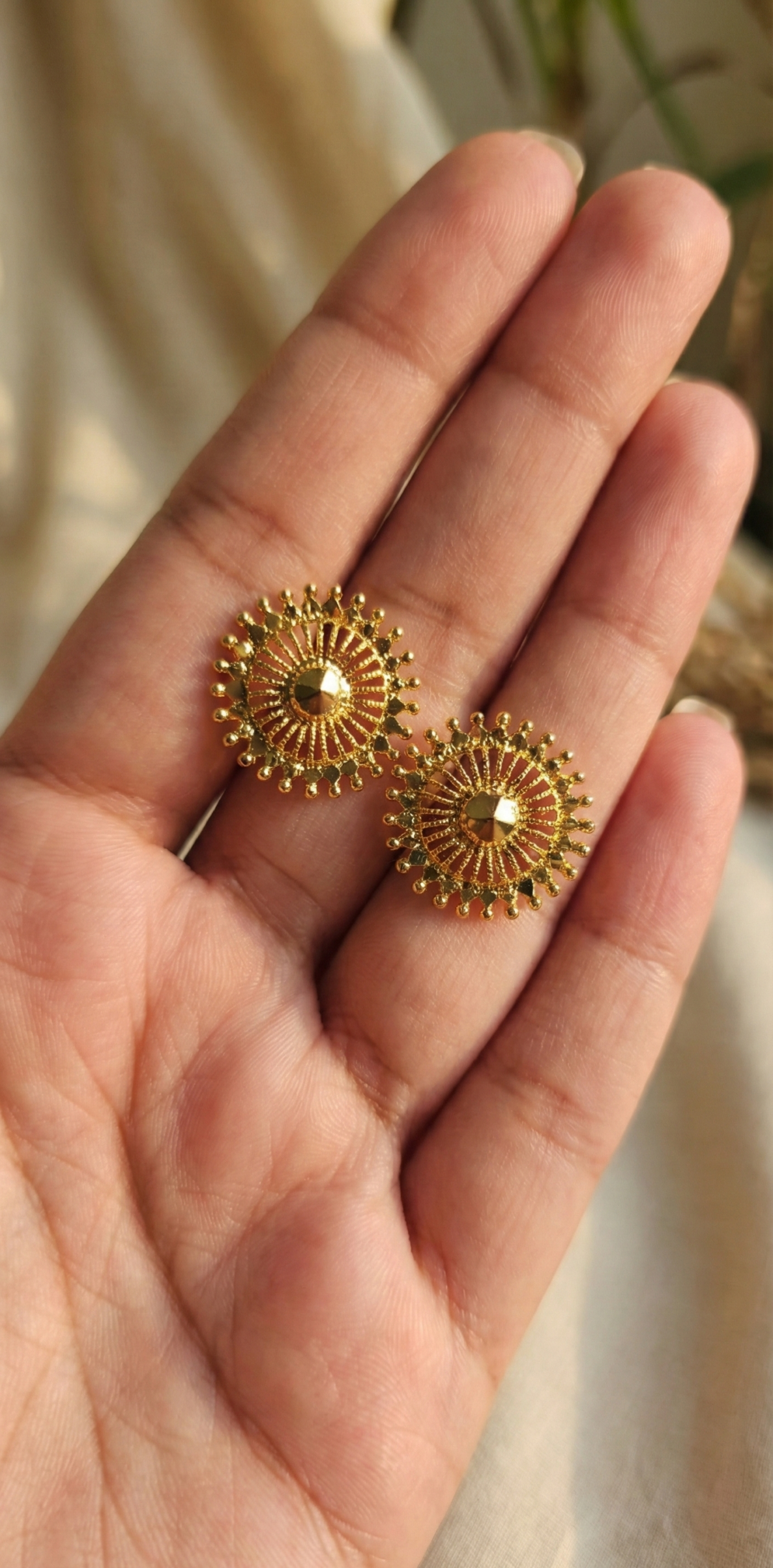 Plain gold color sun shaped studs