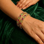 Yellow gold Ruby colored Gem stone bangle_hand